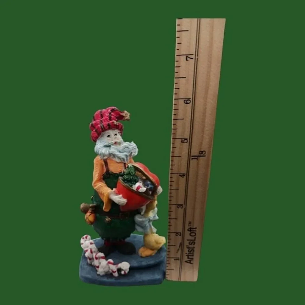 Santa claus figurine with gift and duck